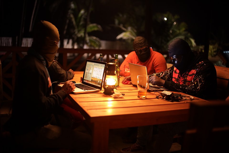 RomanceScams_Trafficked_18b.jpg
Masked subjects on laptops. (Credit: National Geographic)