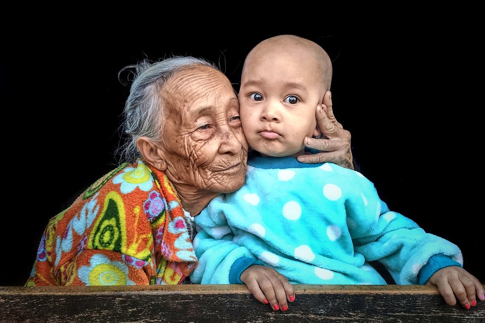 A grandmother hugging her grandson in Myanmar (Aung Thu Ya/AGORA images)