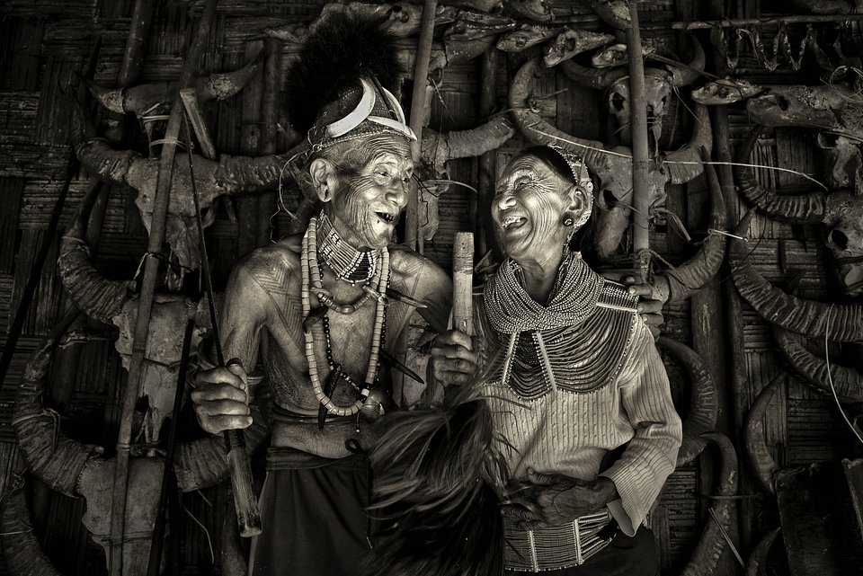 This photo portrays two members of one of India's oldest tribe: the Konyac tribe. The woman on the right (96 years old) was once the queen of the tribe and the man on the left (103 years old) used to be her bodyguard. This couple are the last members of this age group in the Konyac community.